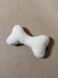 Soft Cashmere Bone Pet Pillow with plush fabric and bone shape.