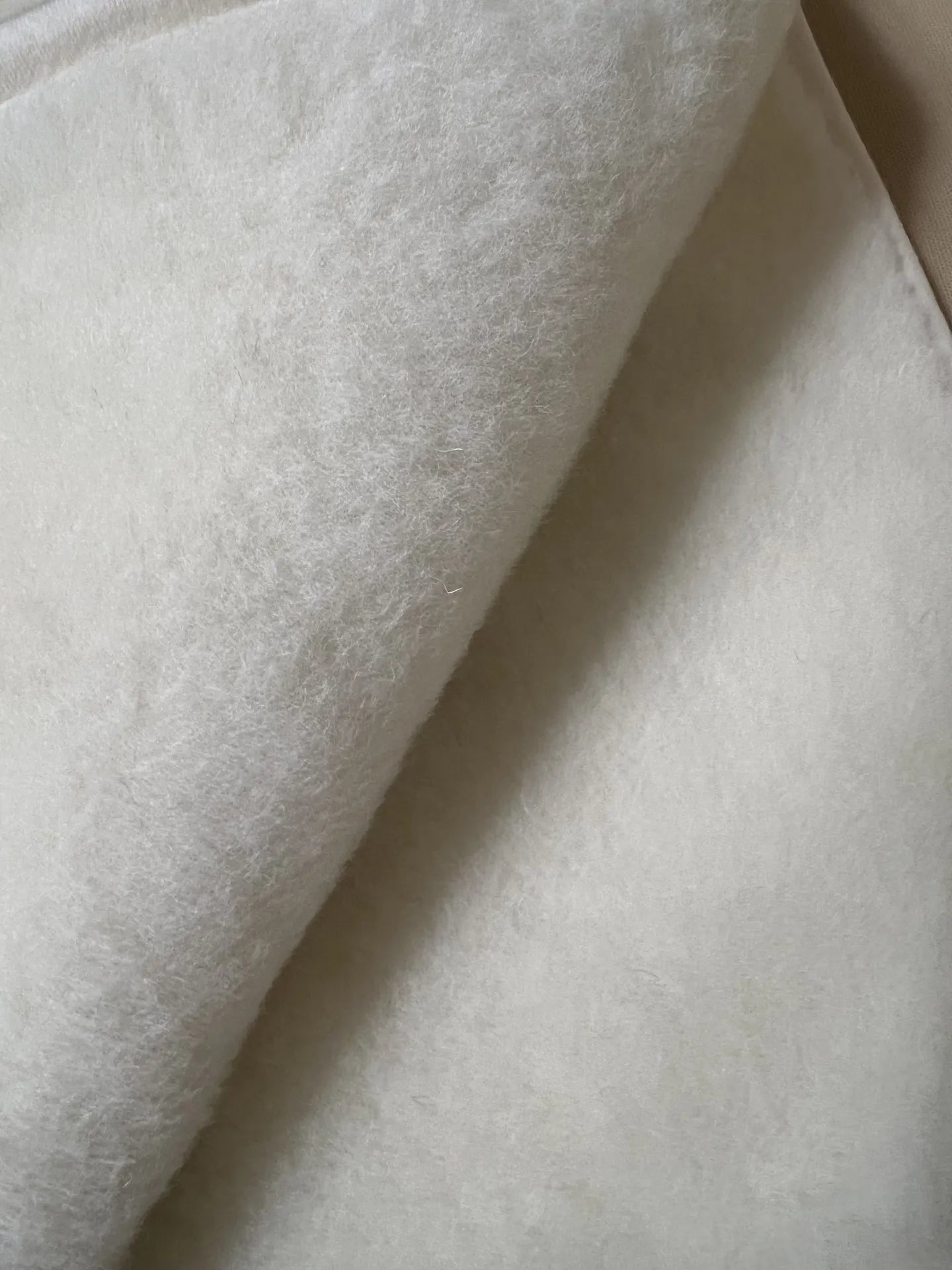 Soft cashmere pet plush blanket featuring a natural, wool texture, perfect for keeping pets warm and comfortable.