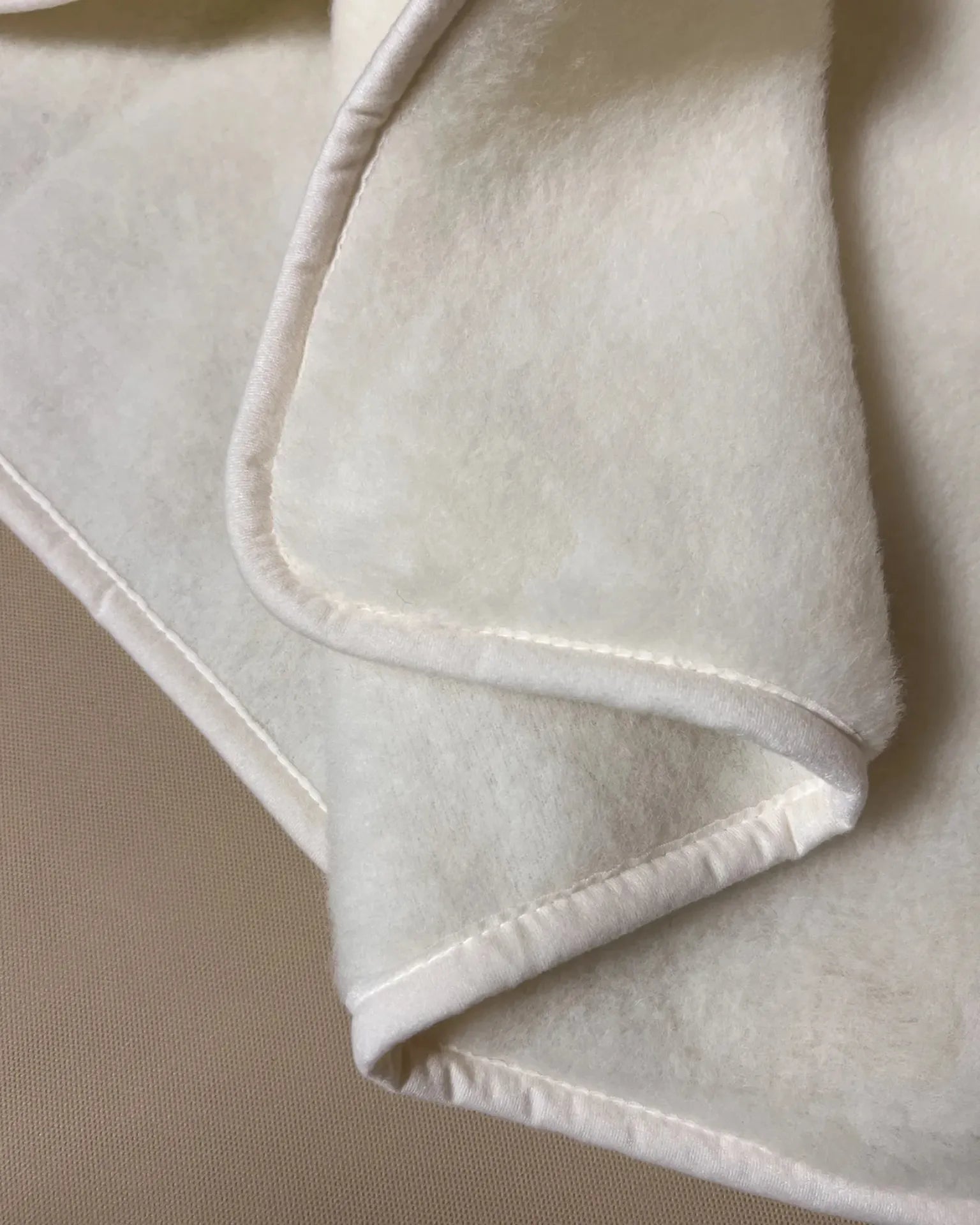 Soft cashmere pet plush blanket featuring warm, textural fabric ideal for keeping pets warm and comfortable.