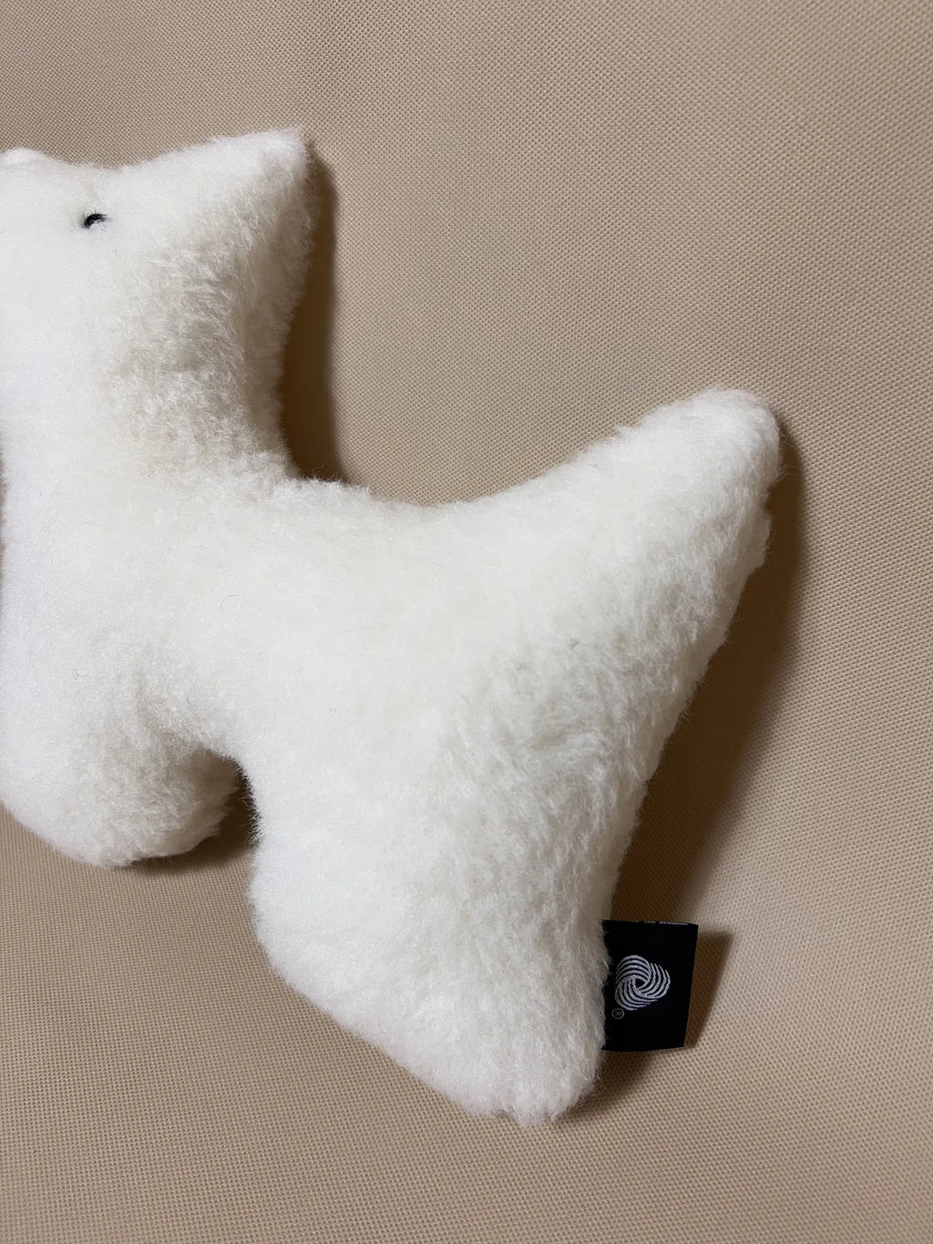 Soft cashmere plush pet toy featuring textural cashmere material, ideal for all pets of all sizes. 