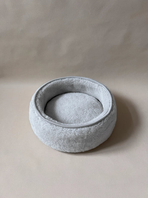 Soft wool alpaca pet bed, plush with a neutral color, ideal for small pets.