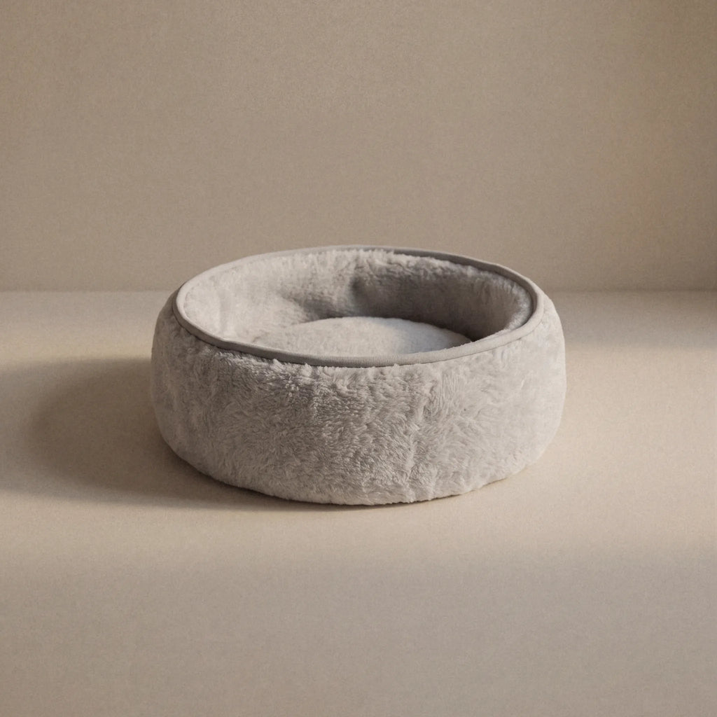 Soft wool alpaca pet bed, plush with a neutral color, ideal for small pets.