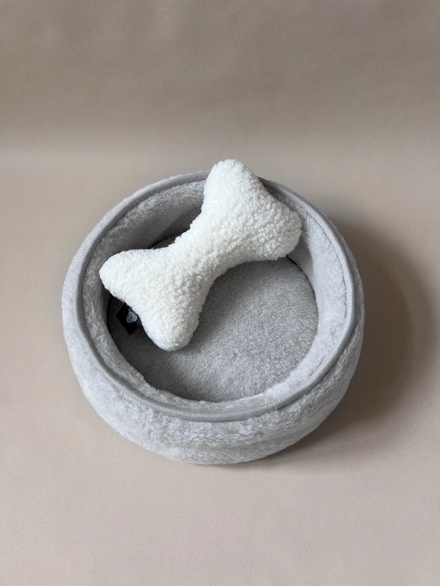 Soft wool alpaca pet bed with plush cushion, ideal for small dogs or cats.