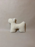 Soft wool plush pet toy featuring a colorful, textural boucle loop material suitable for dogs and cats.
