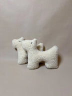 Soft wool two plush pet toys featuring a boucle loop textured material, ideal for dogs or cats to chew and play with.