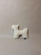 Soft wool plush pet toy featuring a textural boucle loop material for dogs and cats to play and snuggle with.