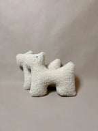 Two soft wool plush pet toys, featuring textural boucle loop material, unique design ideal for cats and dogs.