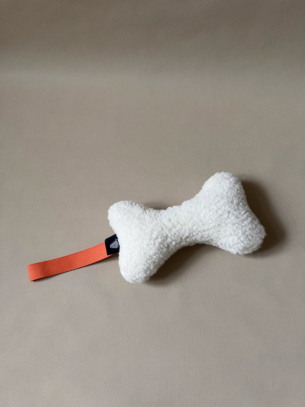 Wool Bone Pet Pillow showing bone shape toy for pets.