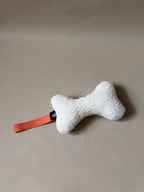 Wool Bone Pet Pillow showing bone shape toy for pets.