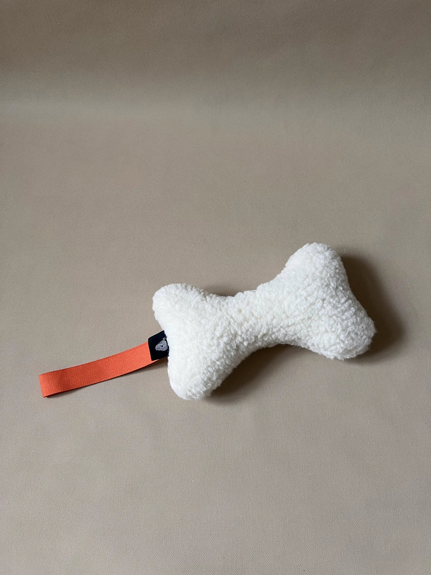 Wool Bone Pet Pillow showing bone shape toy for pets.