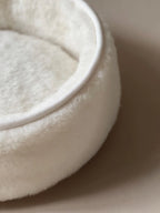Soft wool and cashmere pet bed featuring a plush design perfect for dogs or cats.