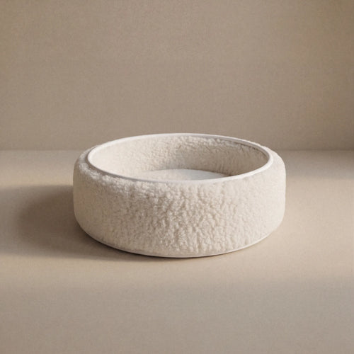 Wool Sheep Bouclé Pet Bed with soft, textured fabric and cushioned interior for pets.