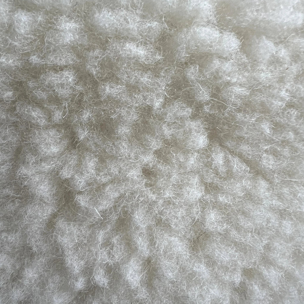 Soft wool sheep bouclé pet bed by with textural plush for pets.
