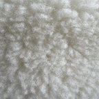 Soft wool sheep bouclé pet bed by with textural plush for pets.
