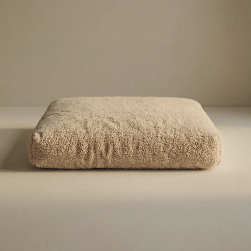 Beige 'Wool Lounge Bouclé Pet Bed' on a neutral background.